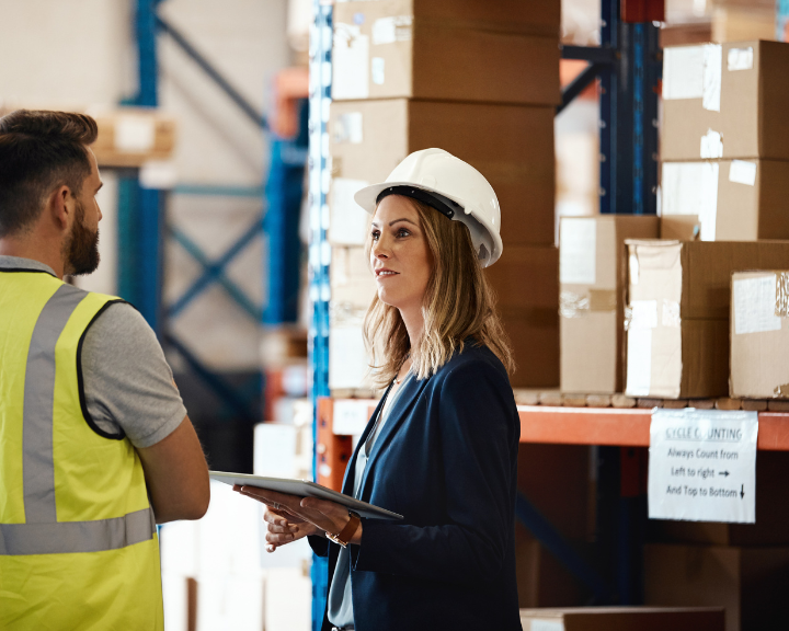 Logistics and supply chain employees planning with data from supply chain visibility platforms.