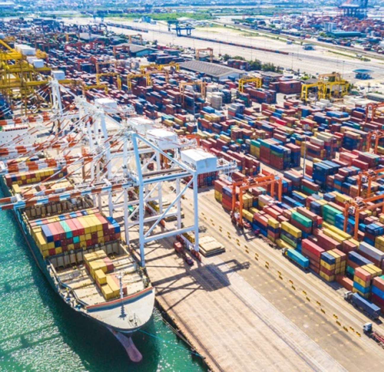 Ship in port with cargo being managed in a Cargowise TMS. 