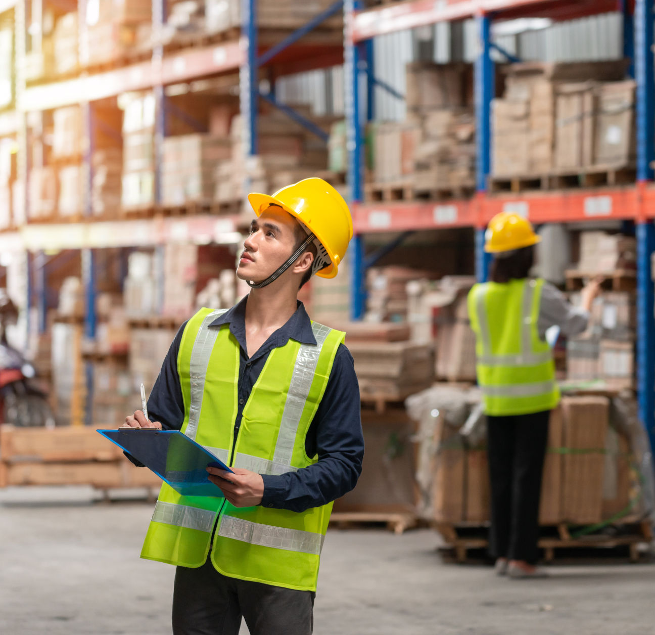 Warehouse worker managing inventory through supply chain automations
