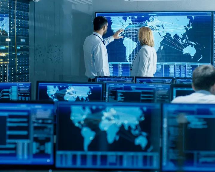 Supply chain professionals analyzing past trends from real-time visibility data